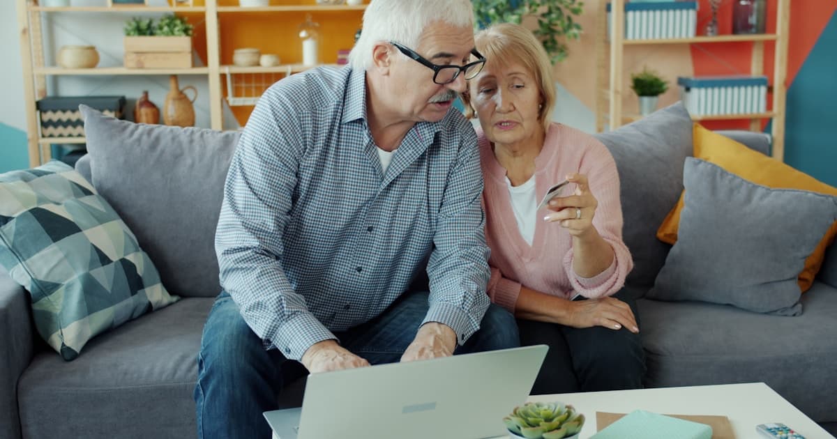 Canadian couple reviewing their retirement budget at the kitchen table